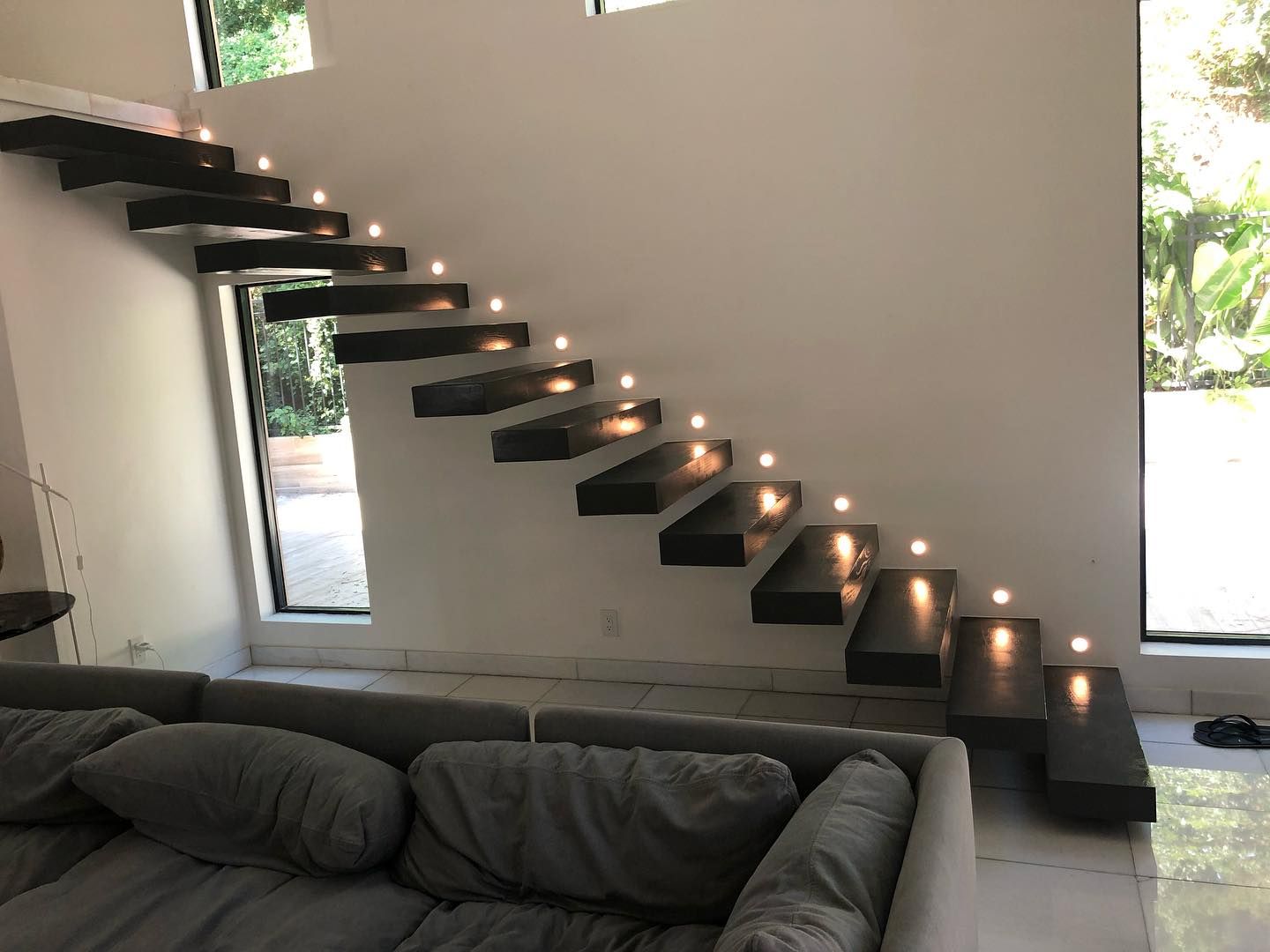 Modern floating staircase with integrated step lighting